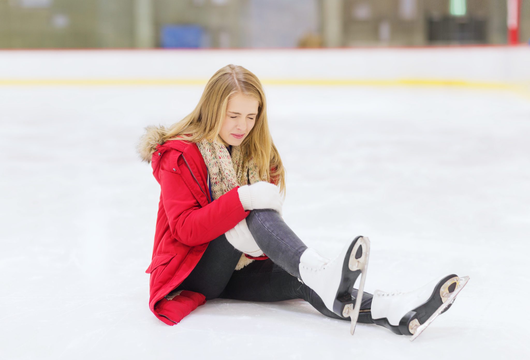 Injured Skater Sitting on Ice