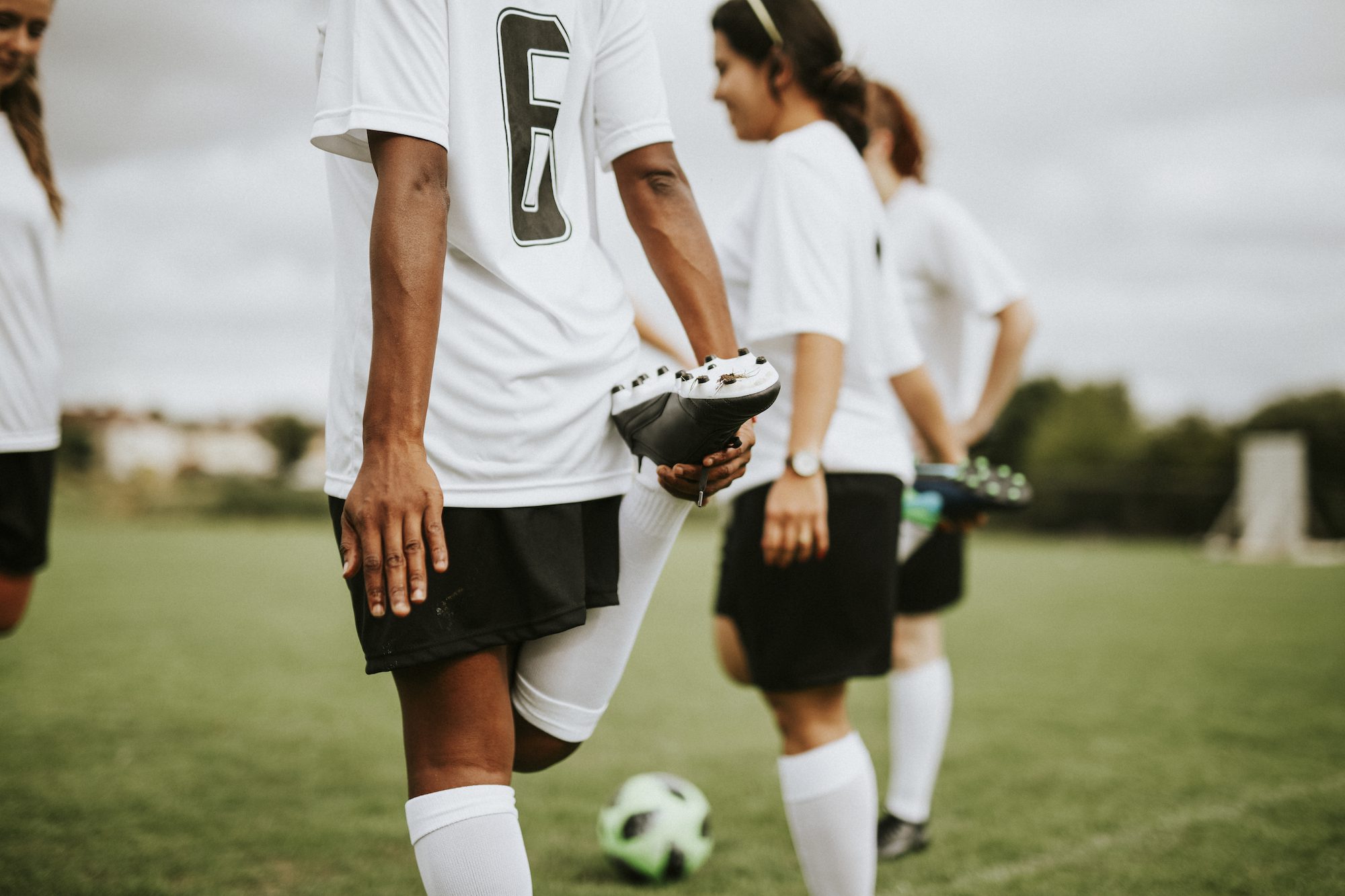 Soccer Players Stretching Before a Game