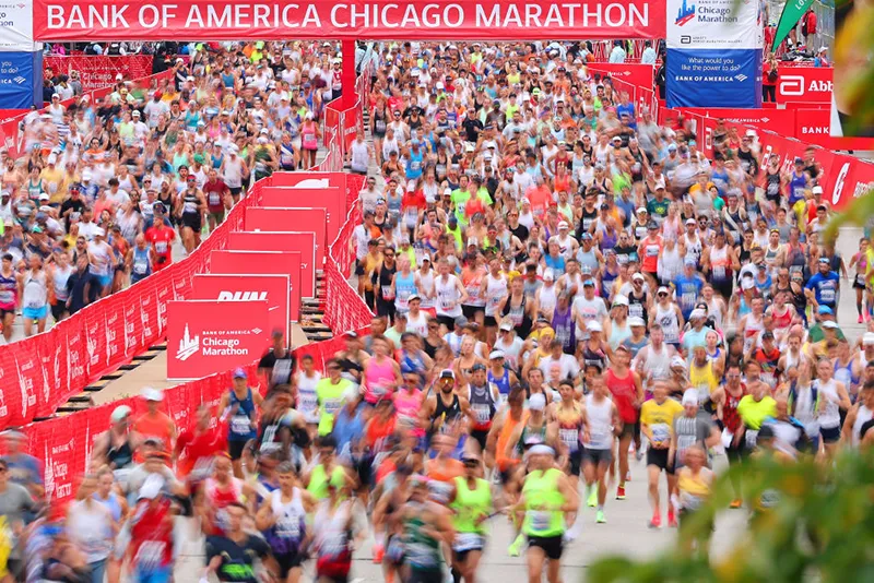 Runners crossing the start line at the Bank of America Chicago Marathon, one of the city's premier endurance events.