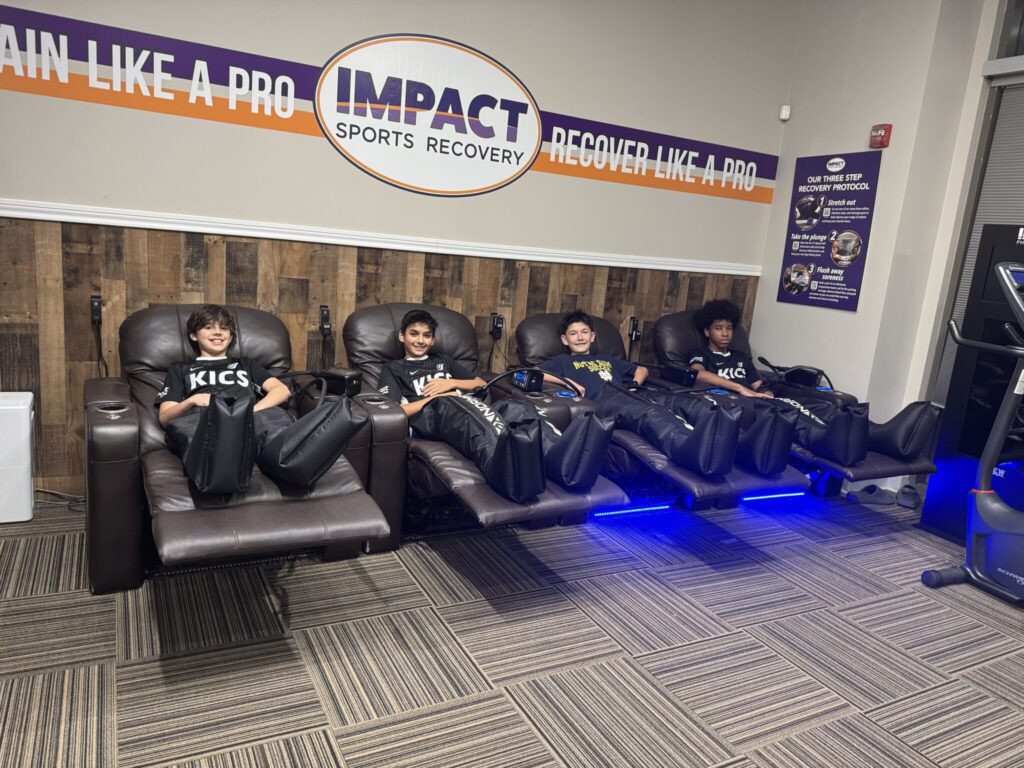 KICS Soccer Team at IMPACT South Loop using Normatec Compression